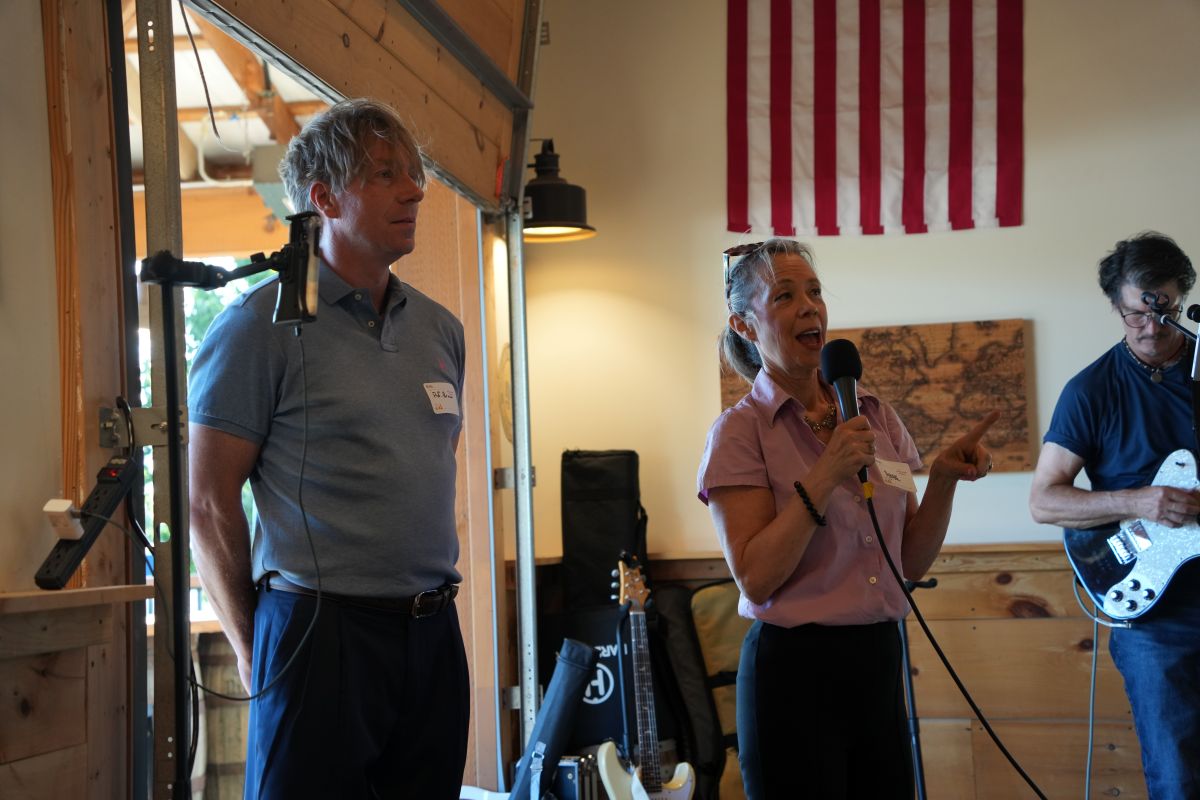 two people standing and talking