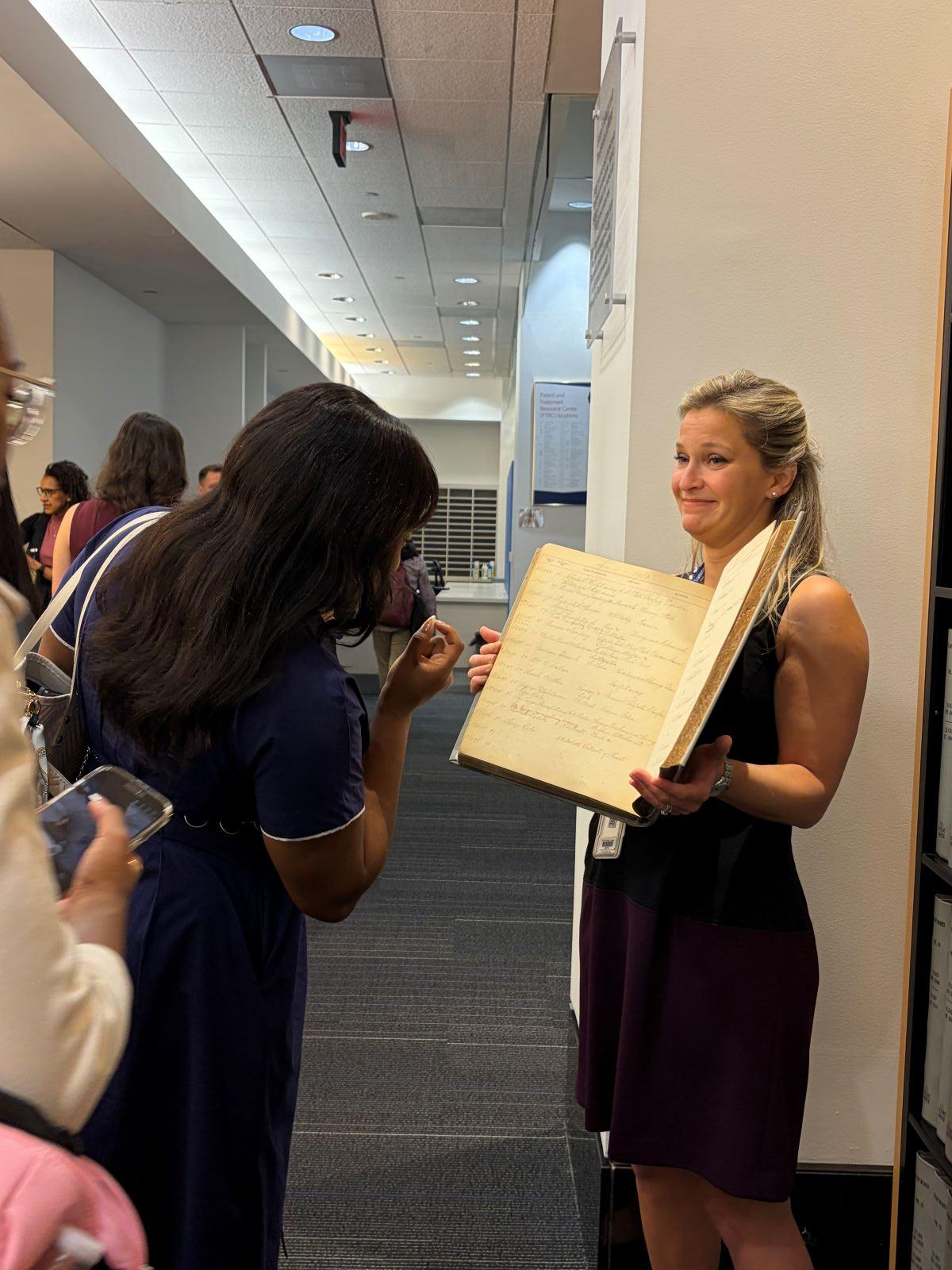 Woman holding book open
