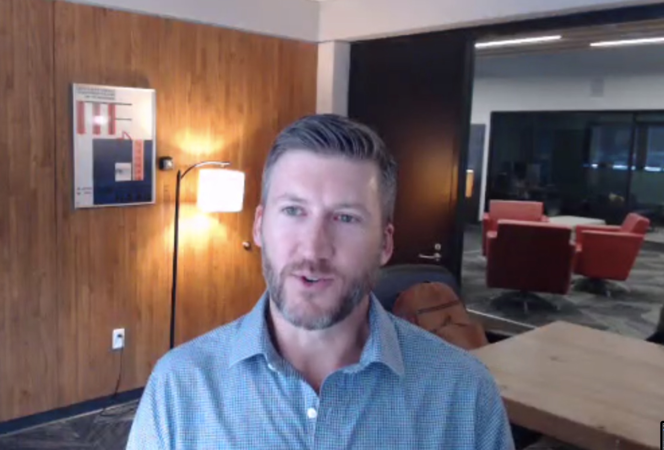 Man on video call from office.