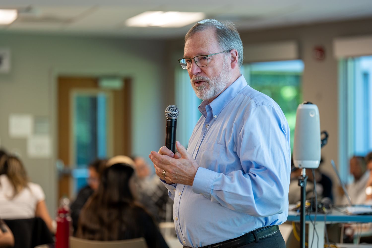 A professor speaking during an event