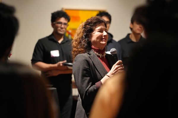A cinematic shot of a woman with mic