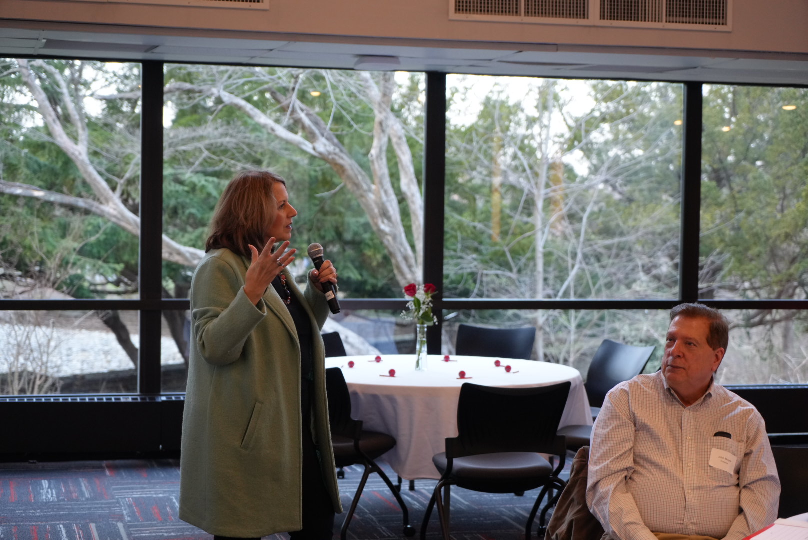 Woman with microphone speaking