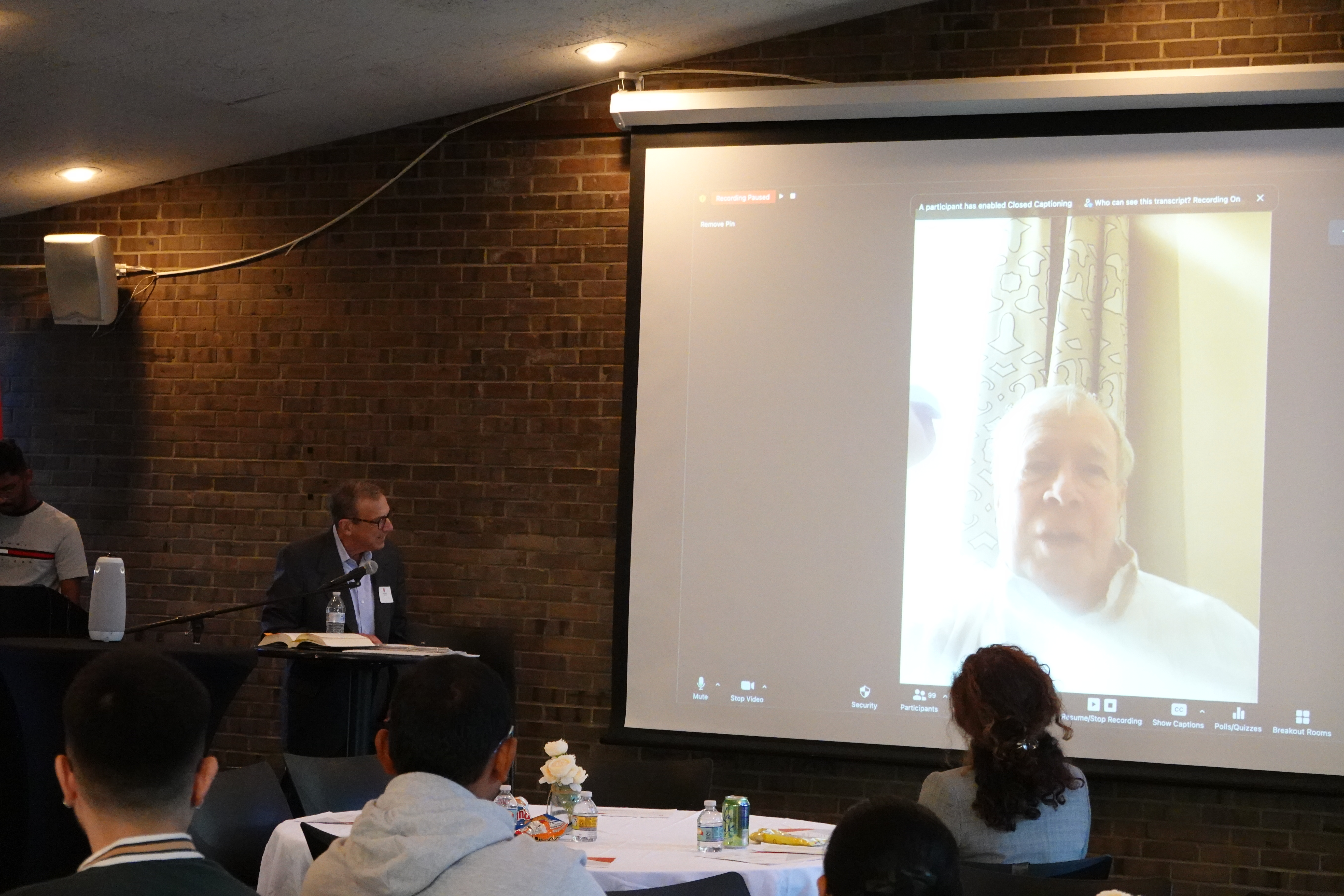 A professor presenting at a panel