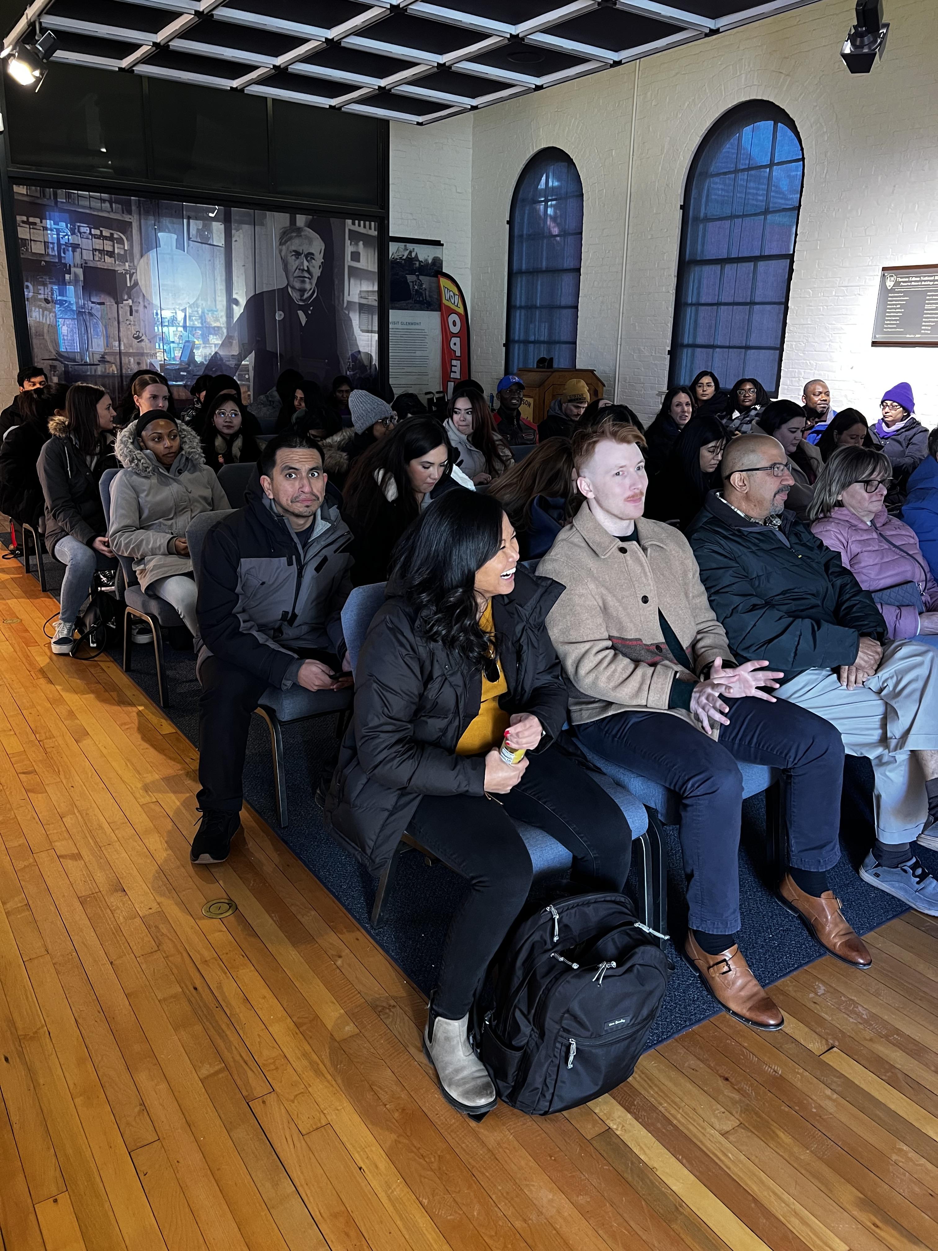 Group of people sitting in chairs