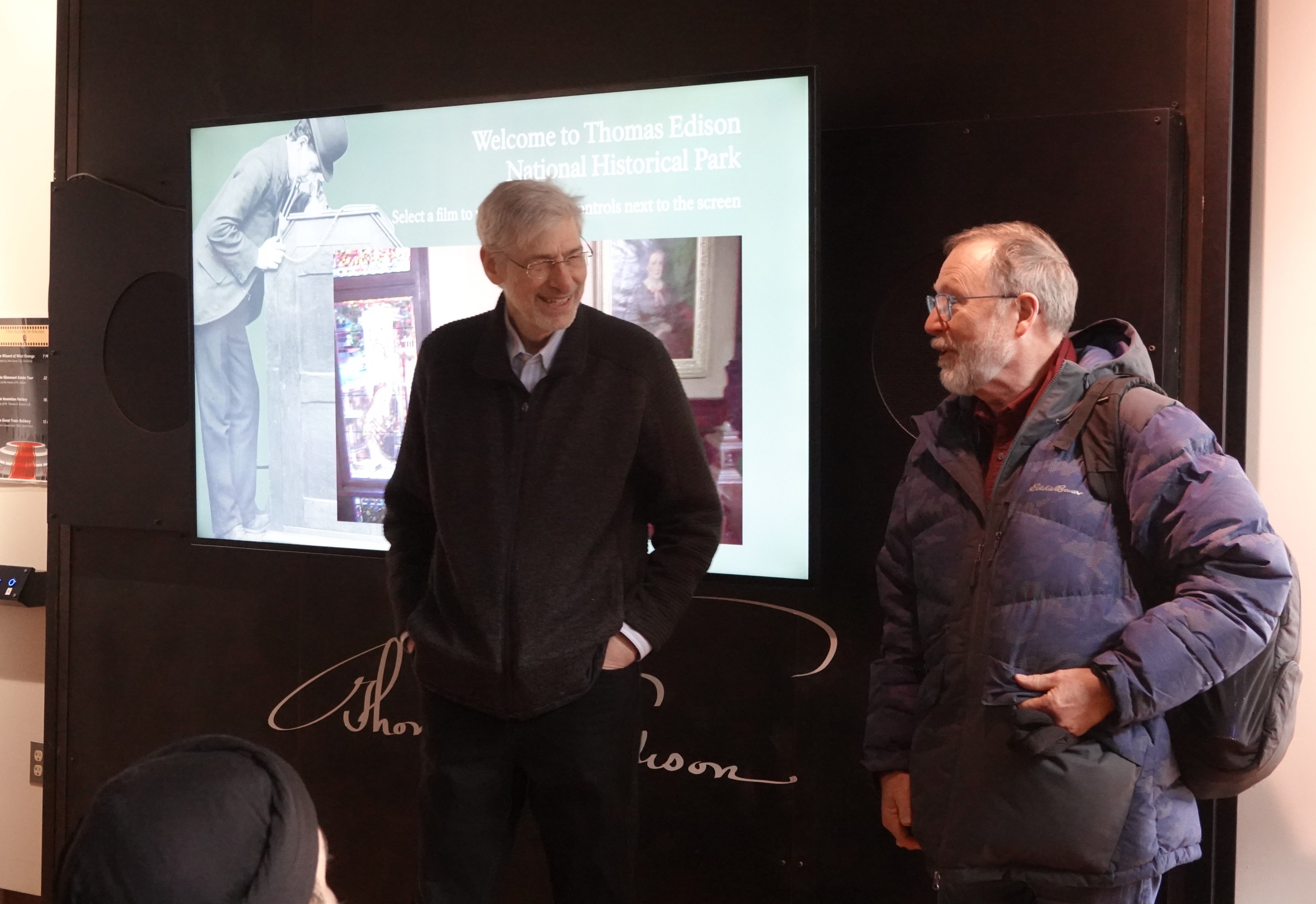 two men standing next to each other