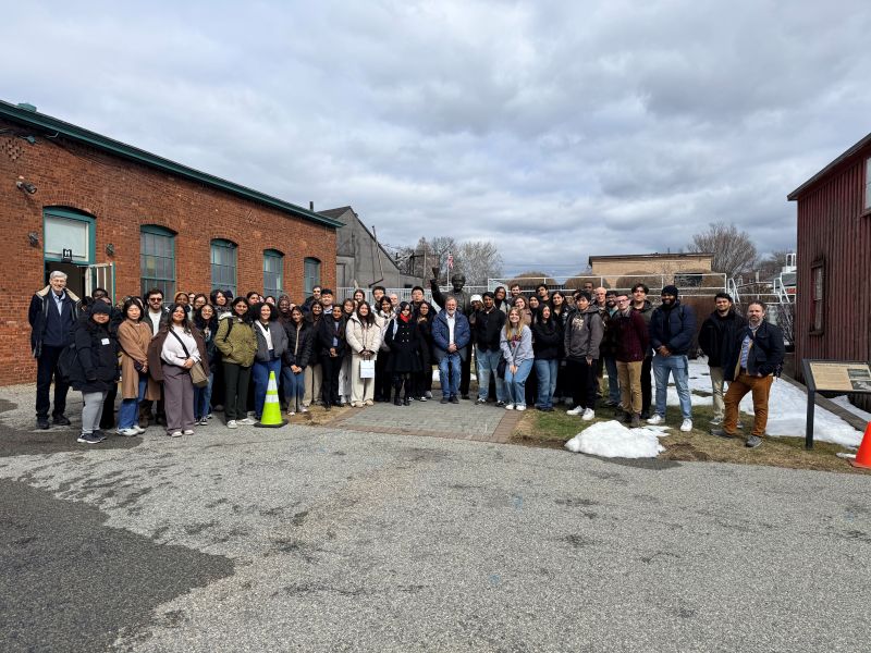 A group of students with their professor on a field trip