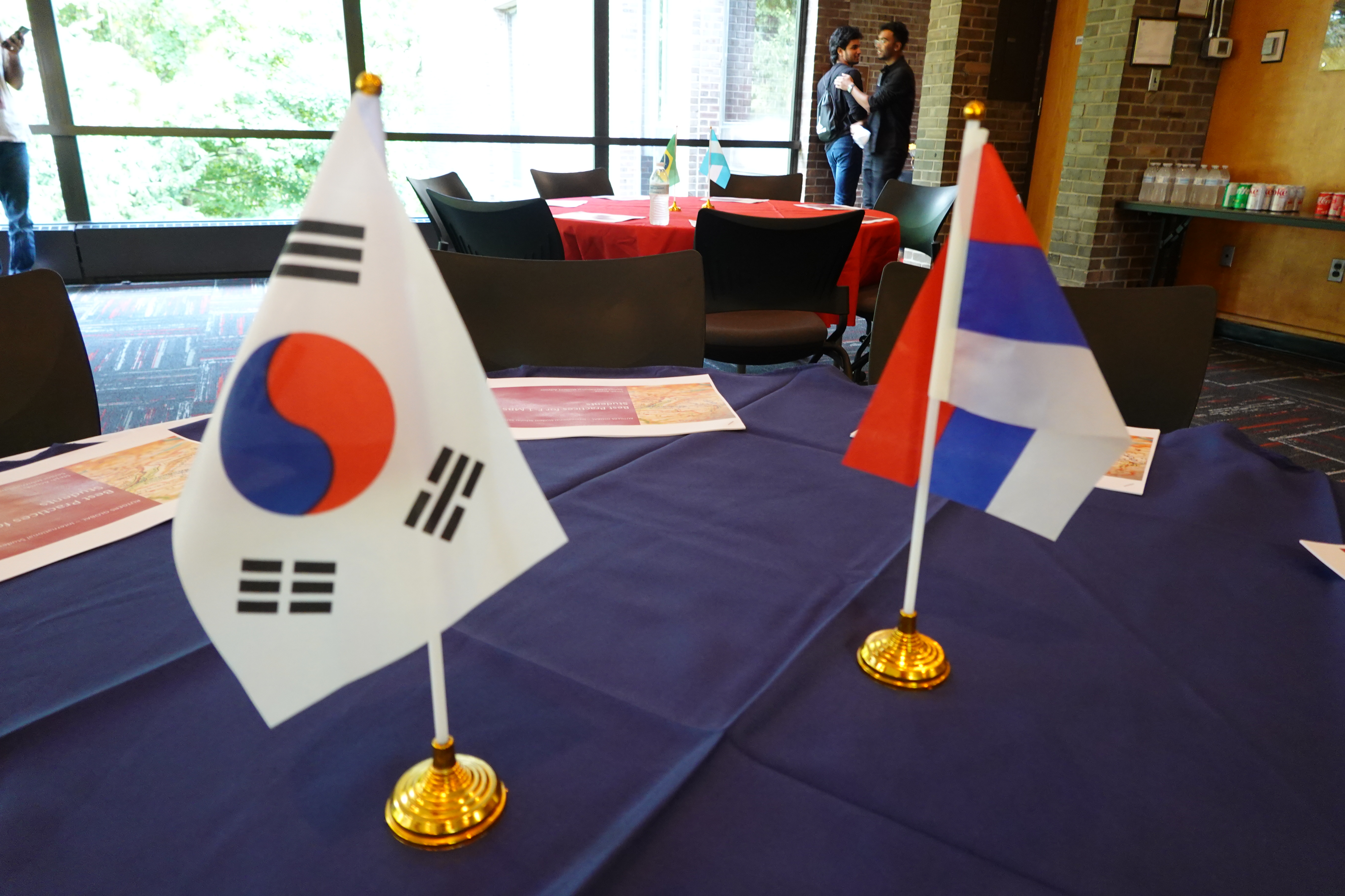 two flags sitting on table top
