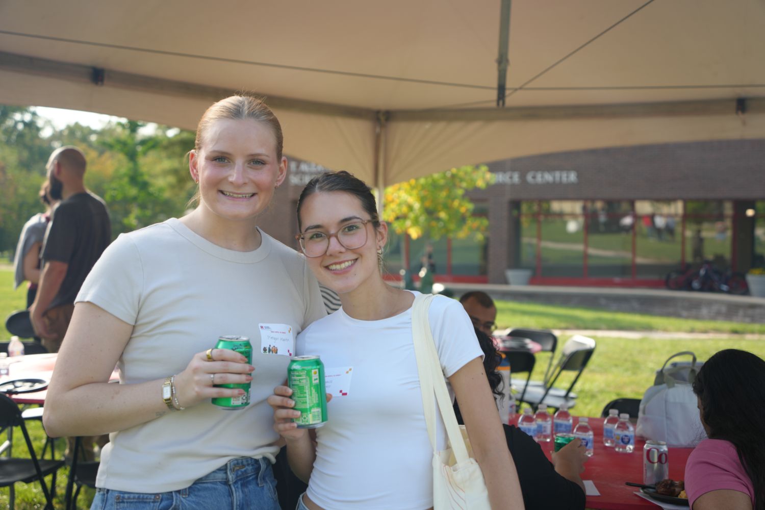 Two girls smiling for a photo at an event
