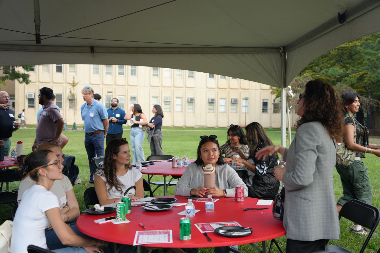 Students listening to a lady at the event