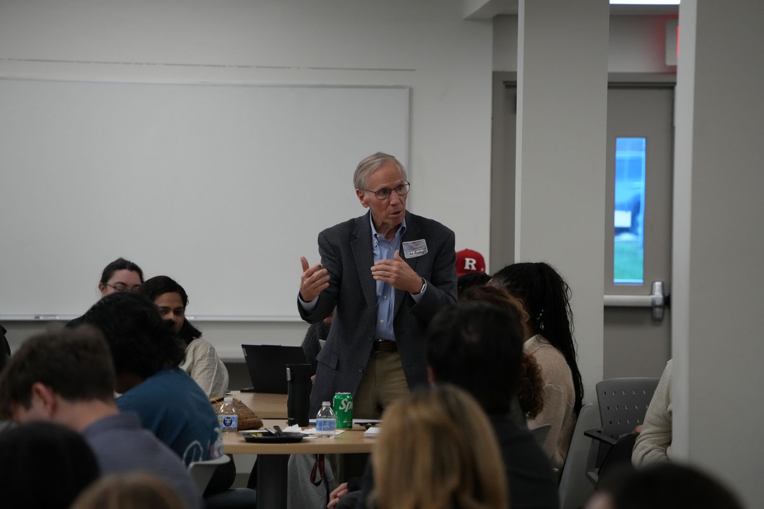 A professor presenting to a class of students