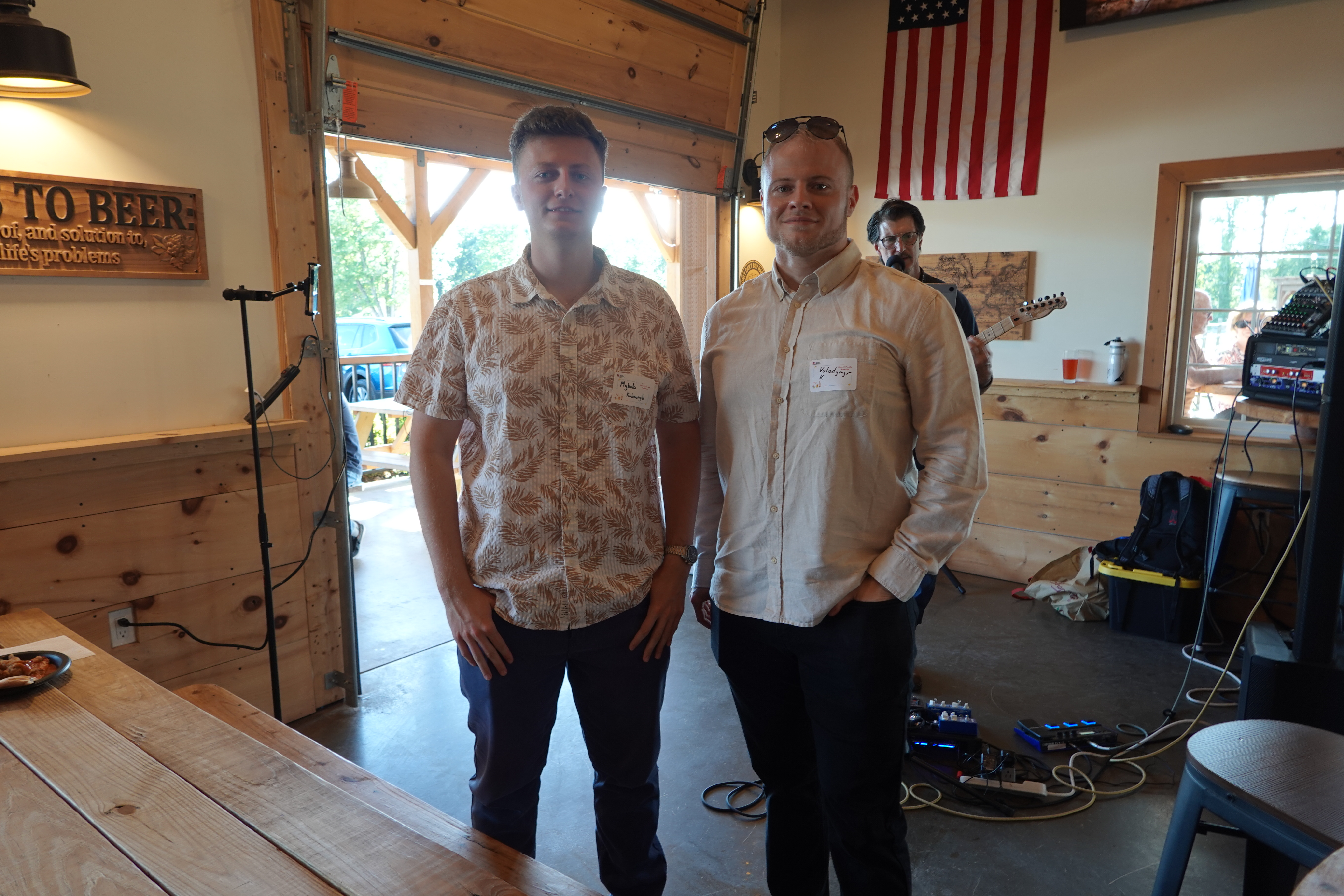 Two men posing for a photo at an event