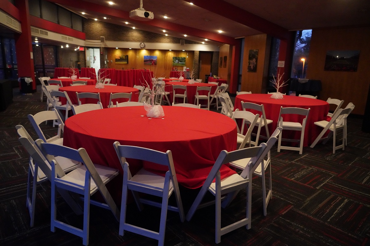 white chairs at a red table