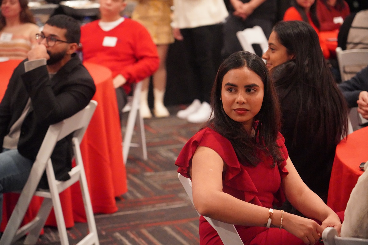 candid photo of a woman sitting at a table