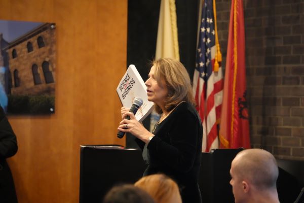 woman speaking into microphone