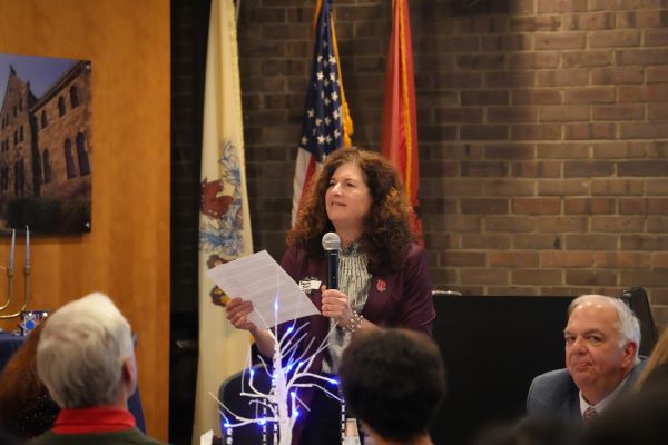 woman speaking into microphone