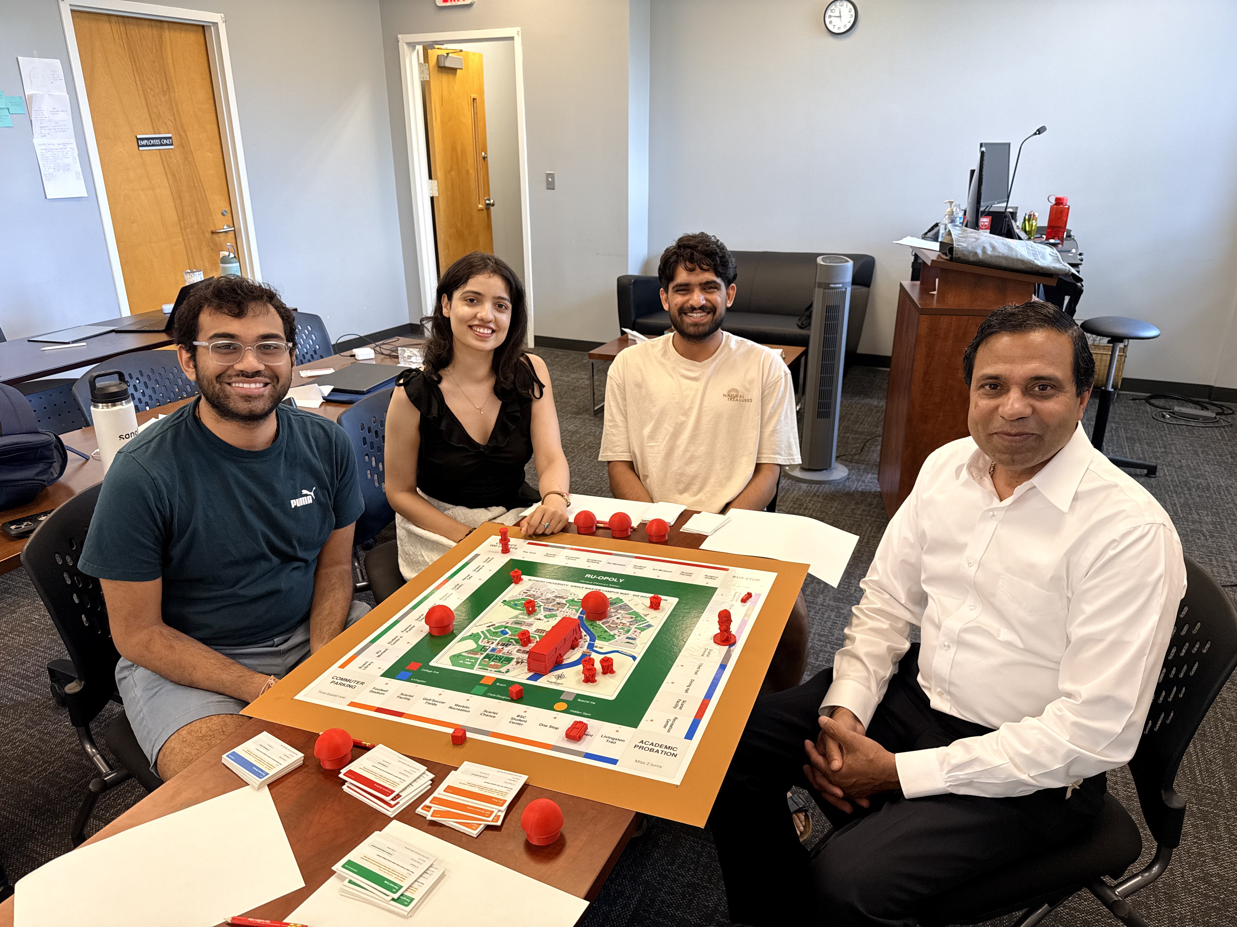 A professor and students playing games during workshop