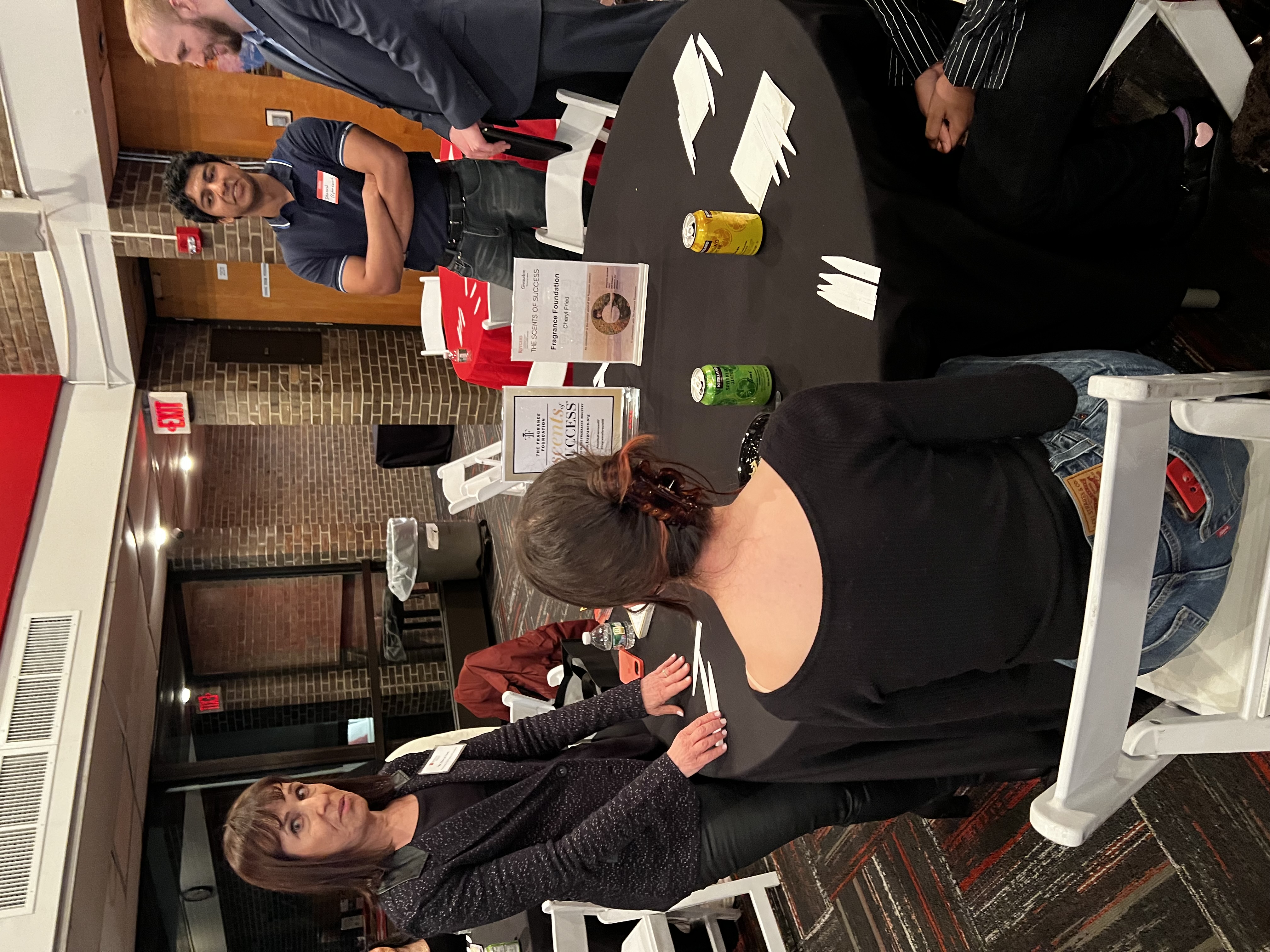 students and speaker at table