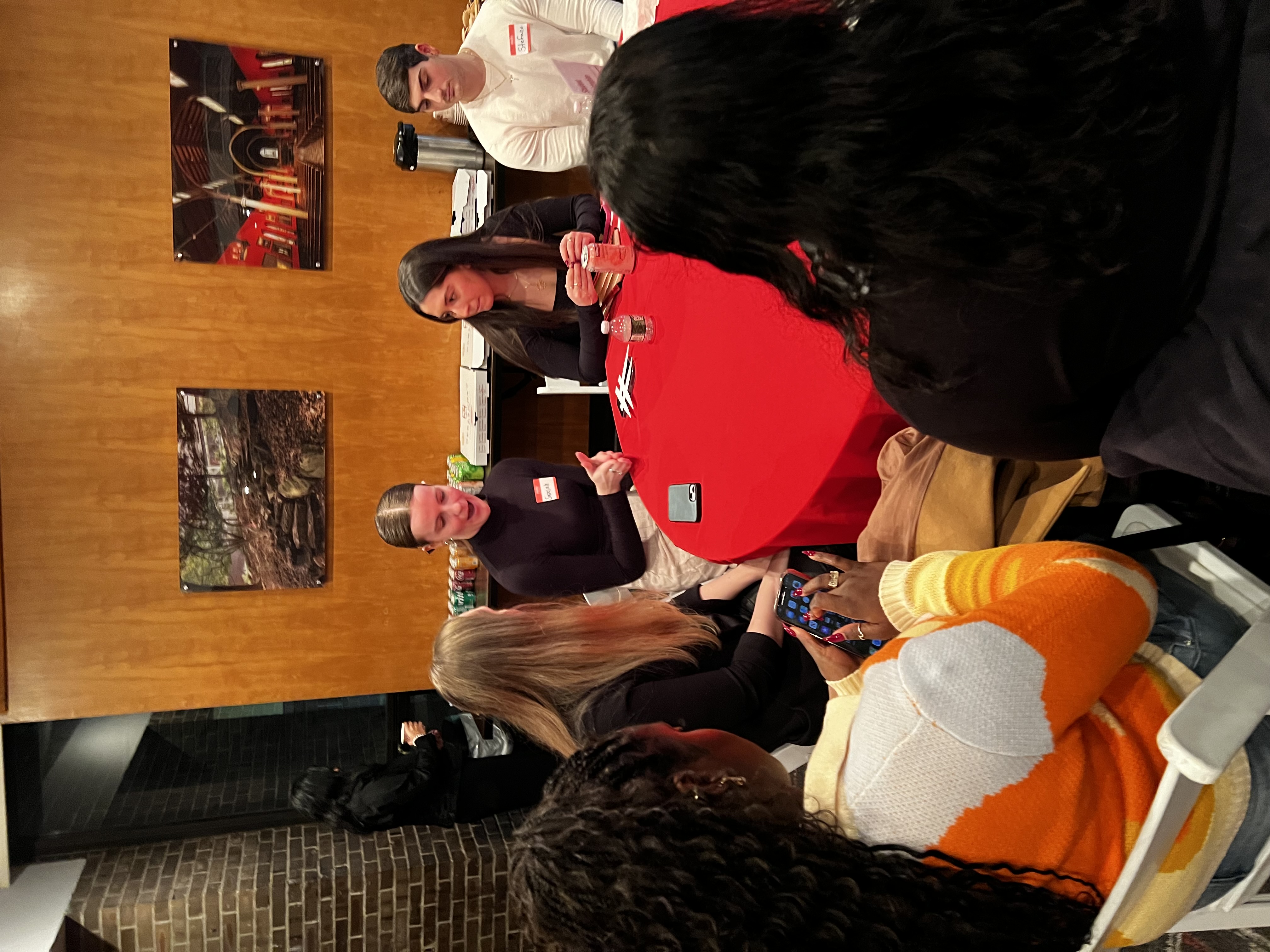 students and speaker at table
