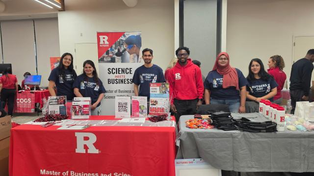 Six students hosting a booth at Rutgers Day