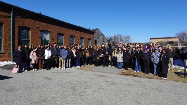 group standing around statue of Thomas Edison