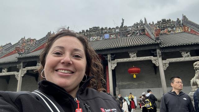 Woman standing in front of building