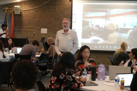 man standing in front of class