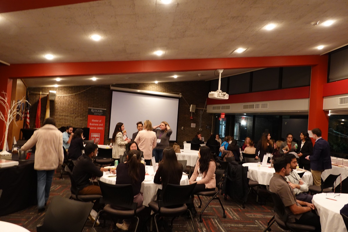 Room full of professionals and students networking