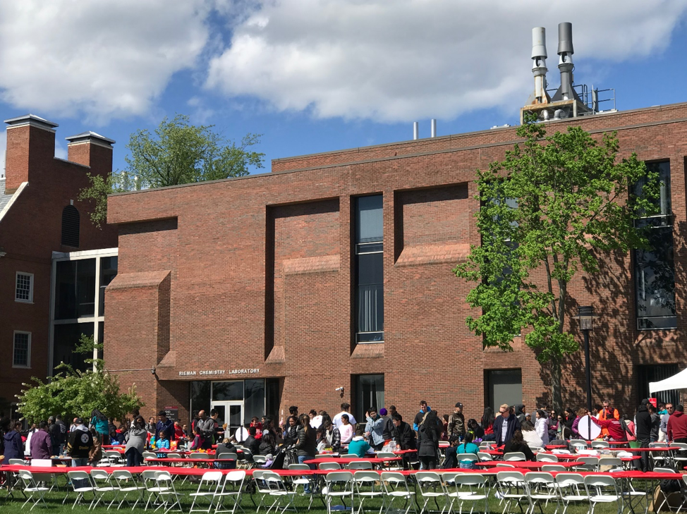 People enjoying the Rutgers Day on the lawns of the Busch campus