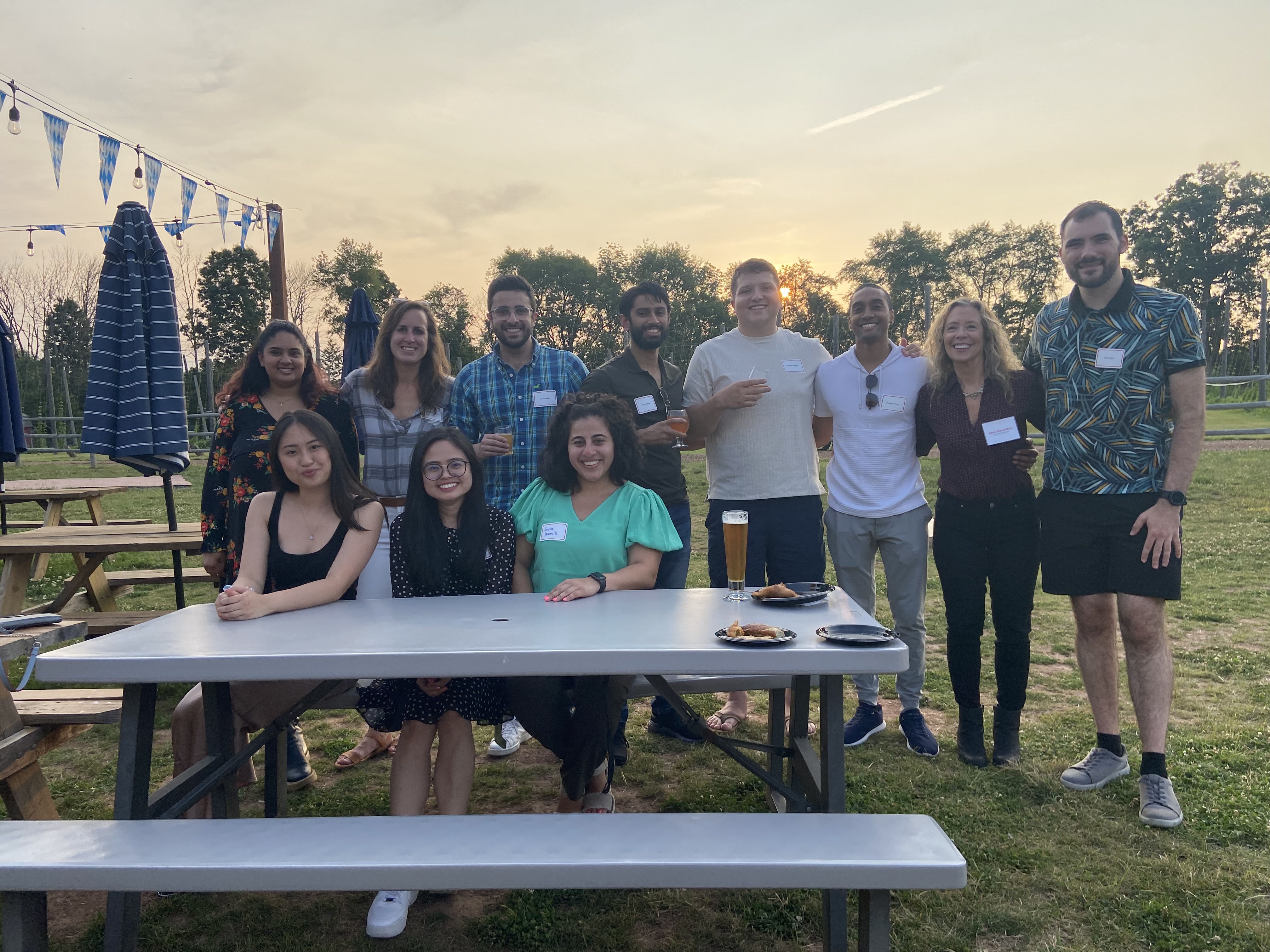 MBS alumni and faculty post outdoors for group photo