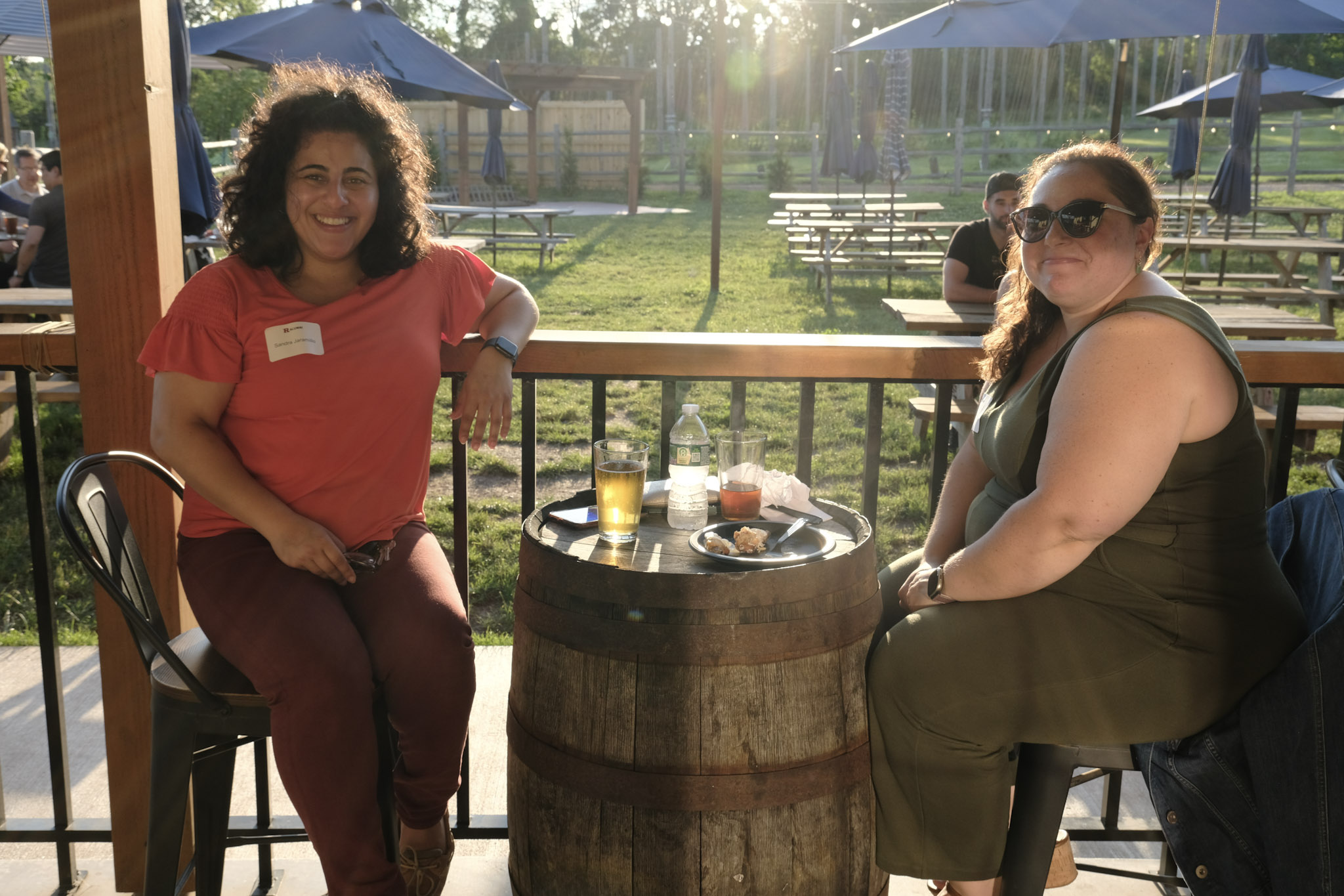 two women sitting and smiling