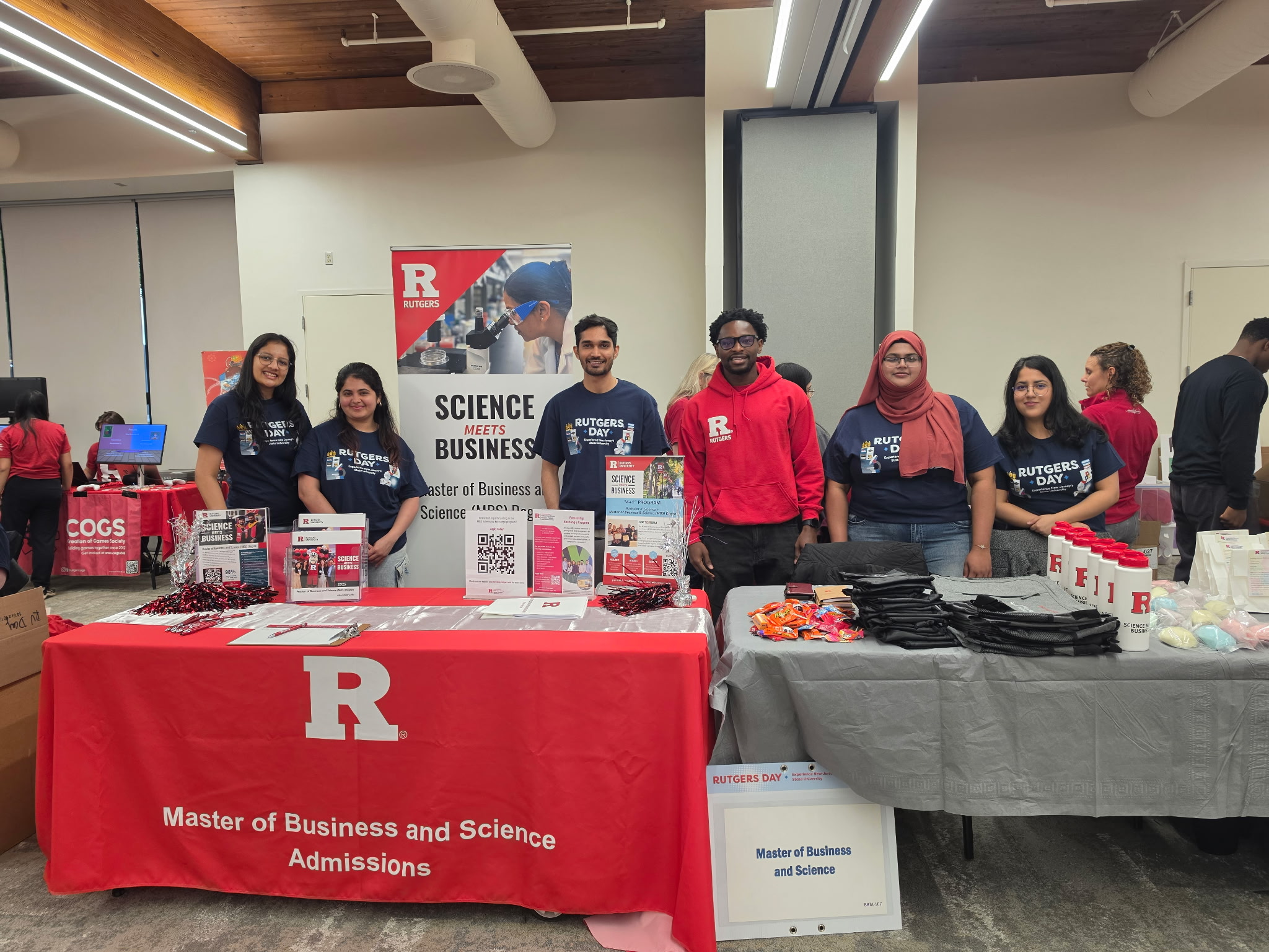 Six students hosting a booth at Rutgers Day