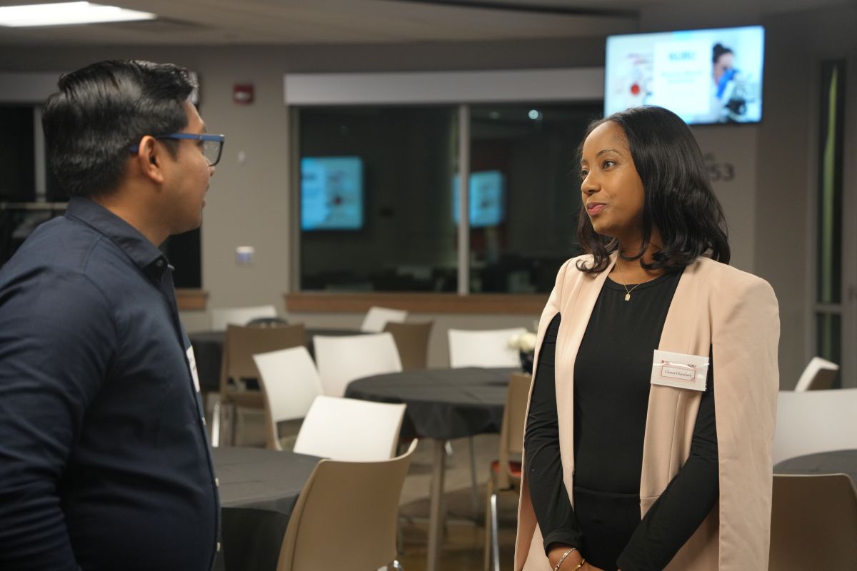 A picture of two people speaking