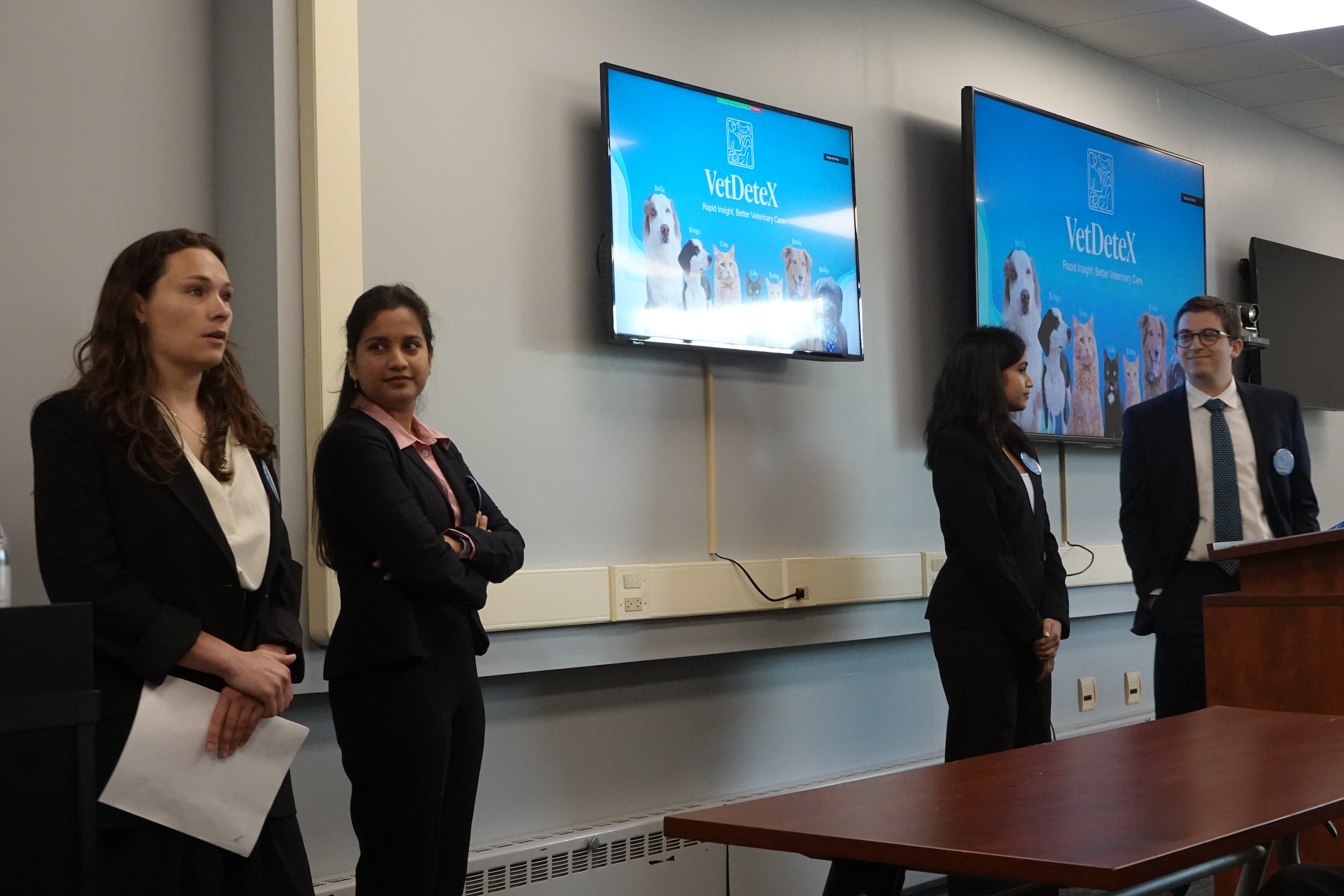 Group of four presenting