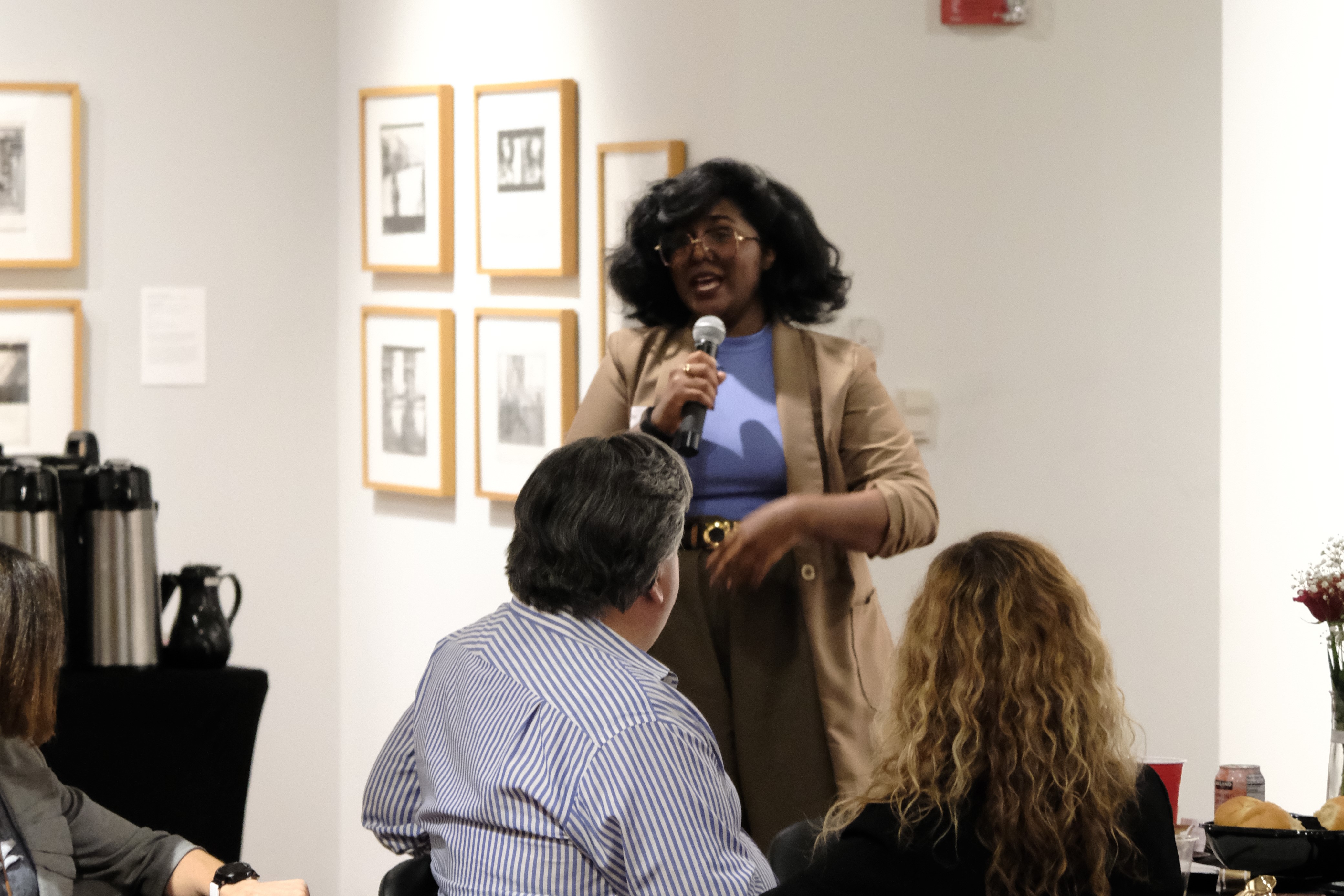 woman with microphone speaking