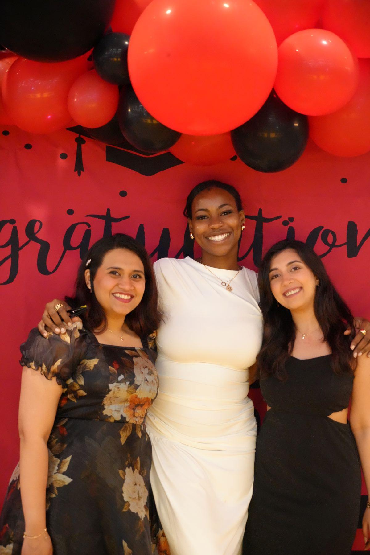 students standing in front of backdrop