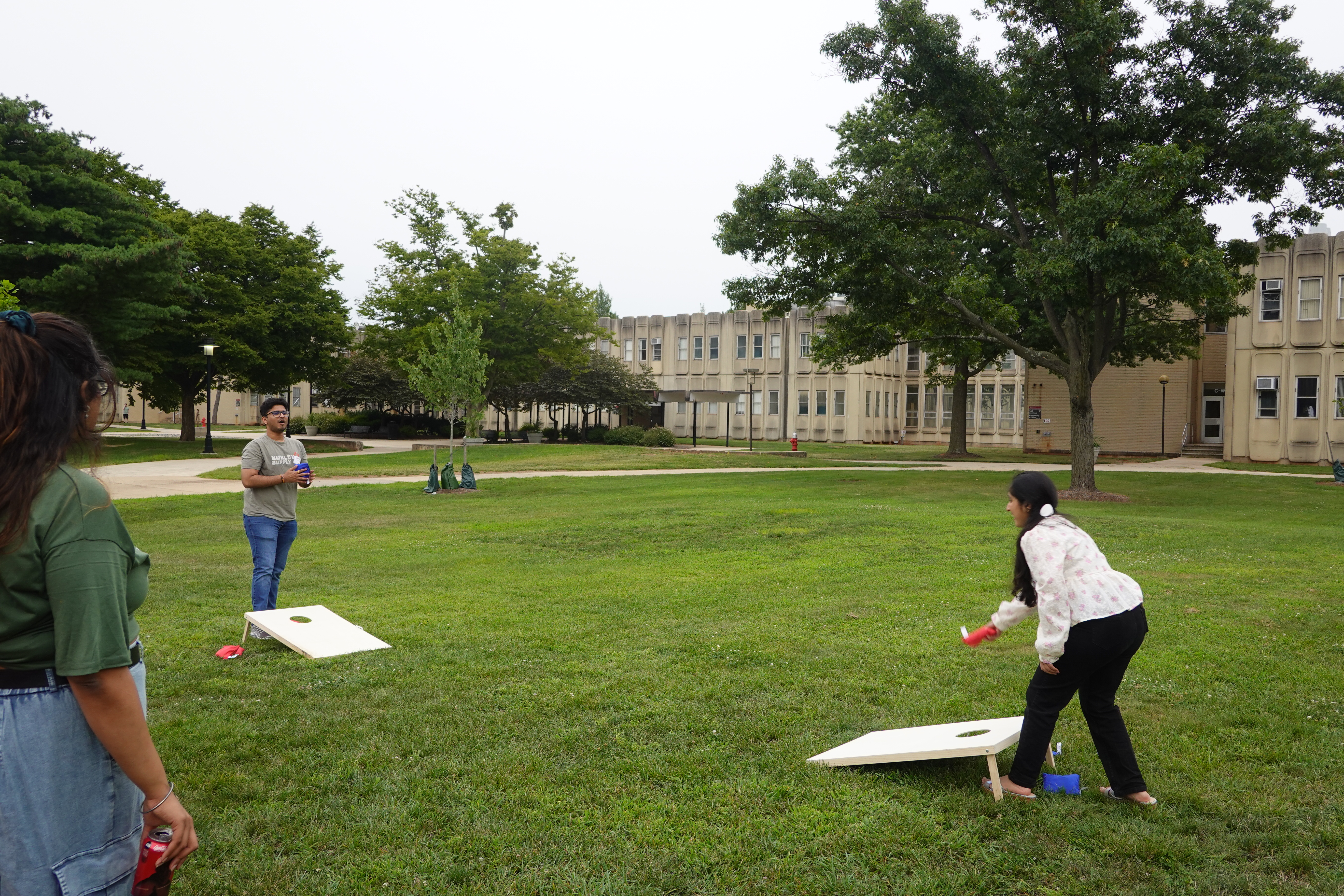 students playing cornhole