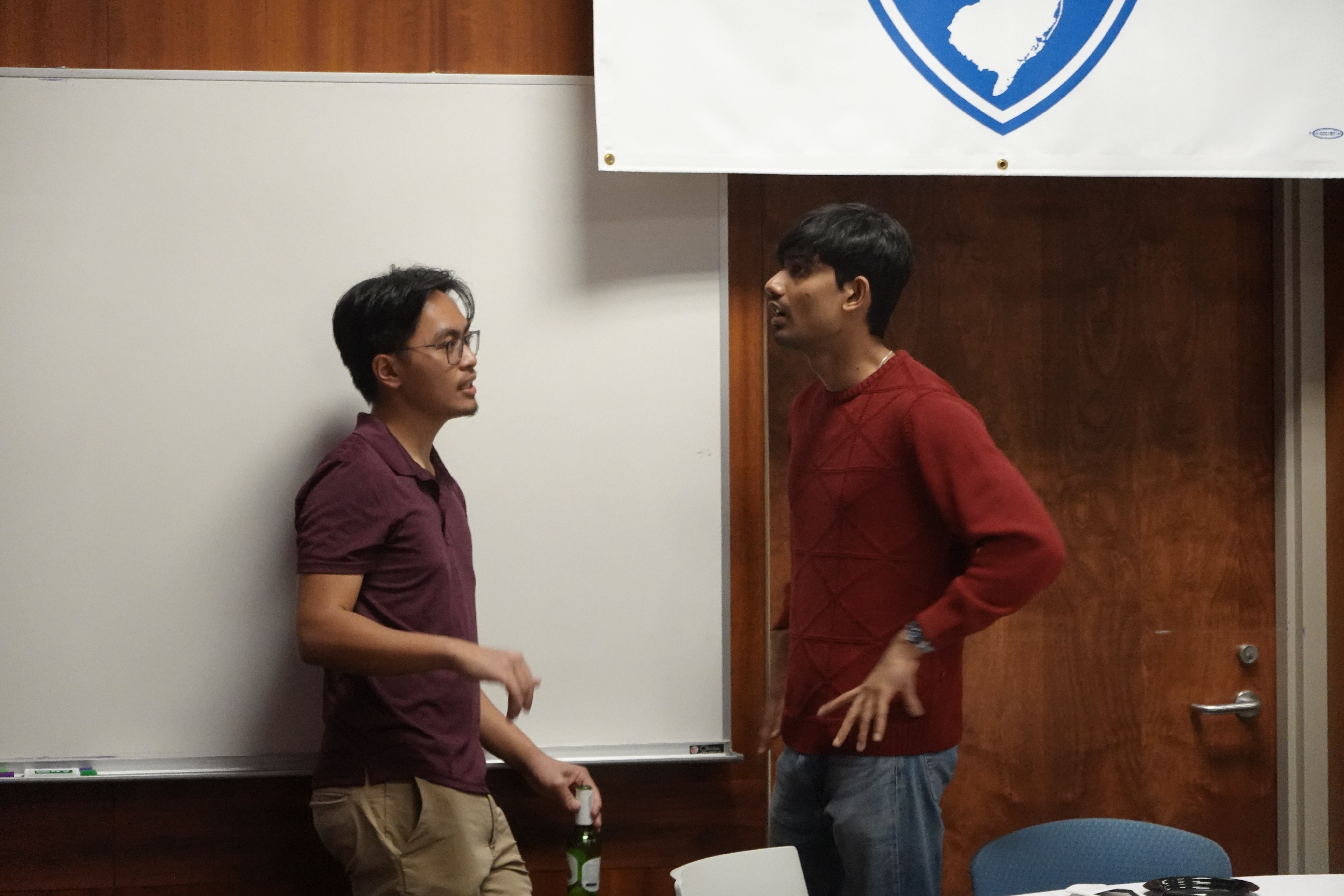 two people standing and talking