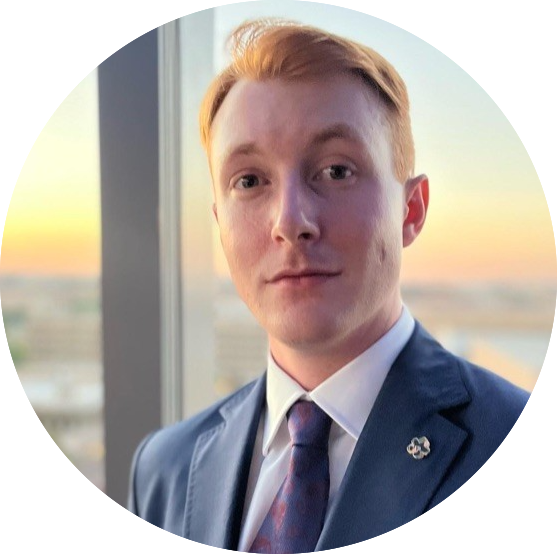 A man in professional attire for headshot