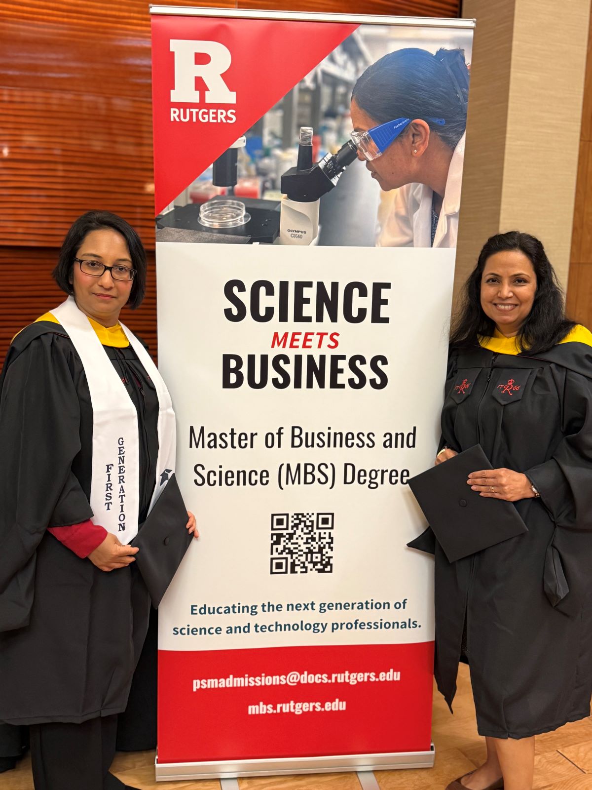 students standing next to banner