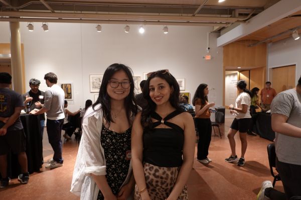 Two girls posing in an art museum