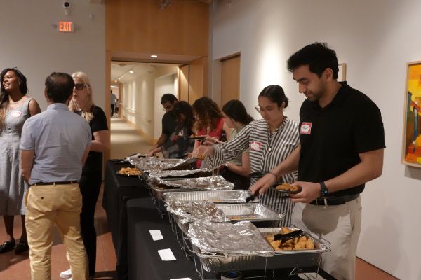 People serving food at an event