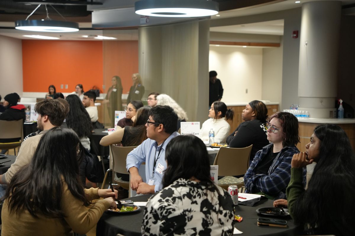 A table full of students focusing on the presentation