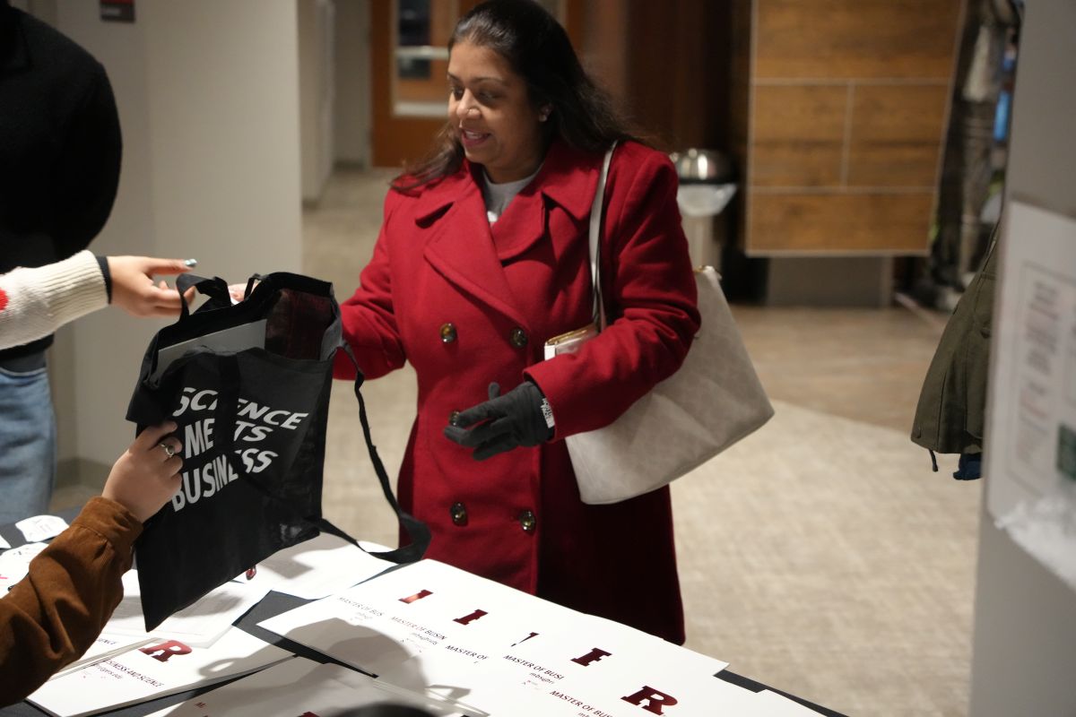 A student being handed the goodie bag
