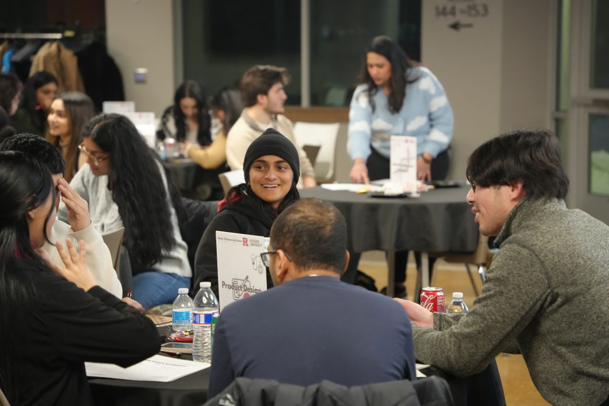A bunch of students talking and laughing