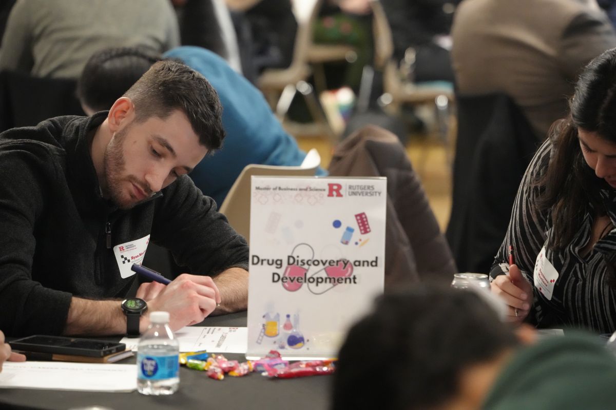 A student writing something on the paper