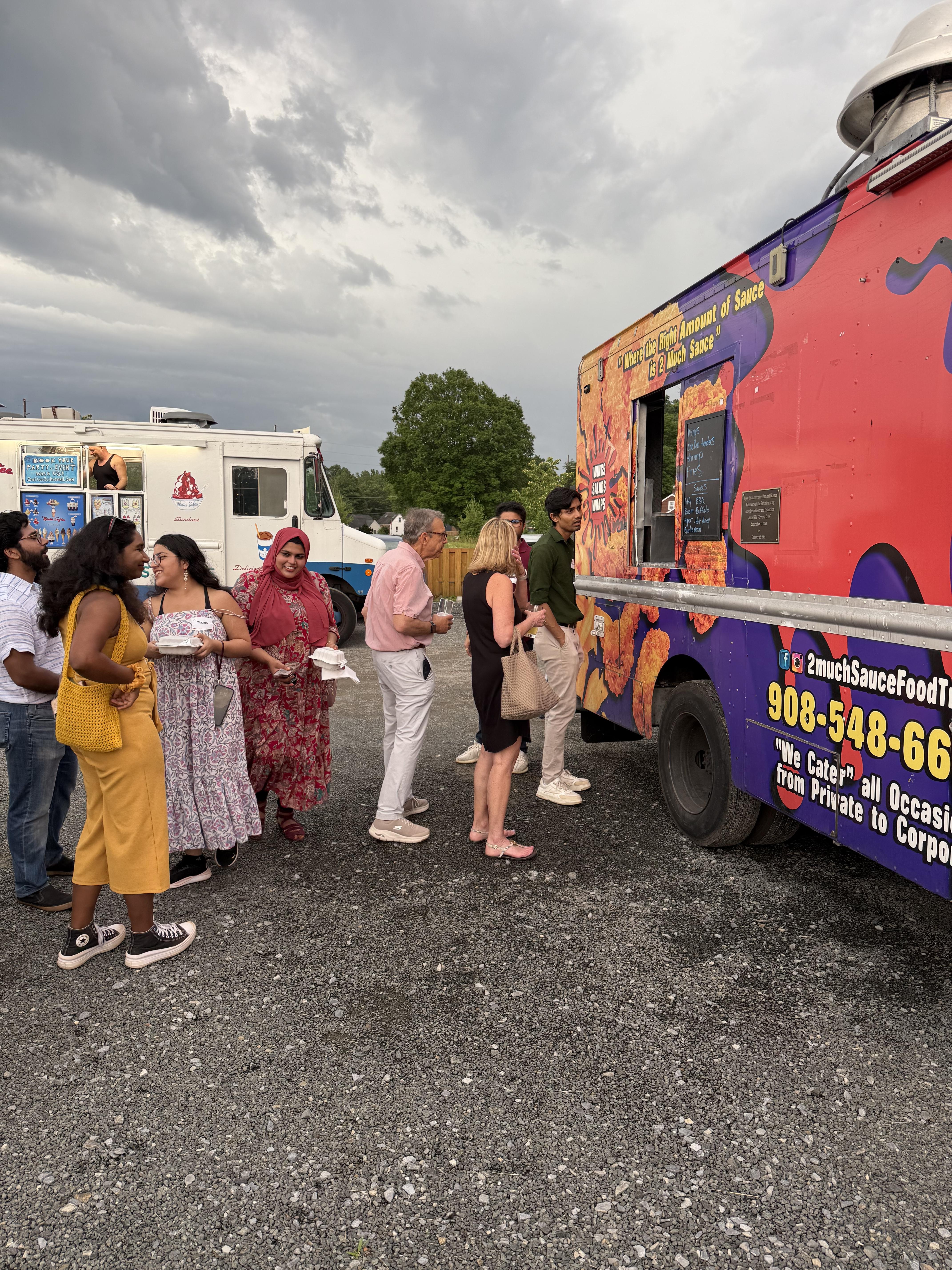 people eating at food truck