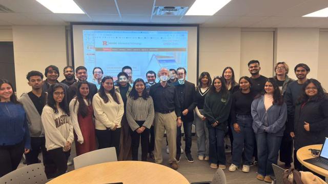 Picture of Rutgers students with their professor and Guest speaker in class