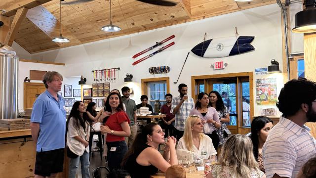 candid photo of group of people at brewery