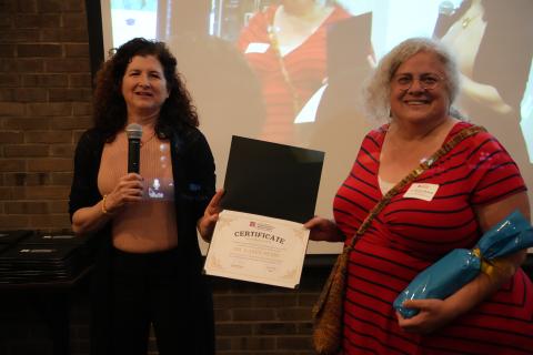 woman receiving award