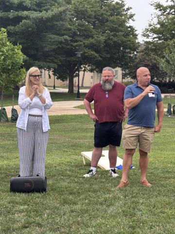 people standing with microphone